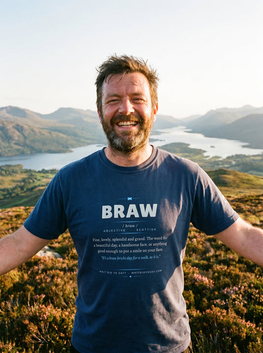 Person outdoors wearing the navy BRAW dictionary definition tee