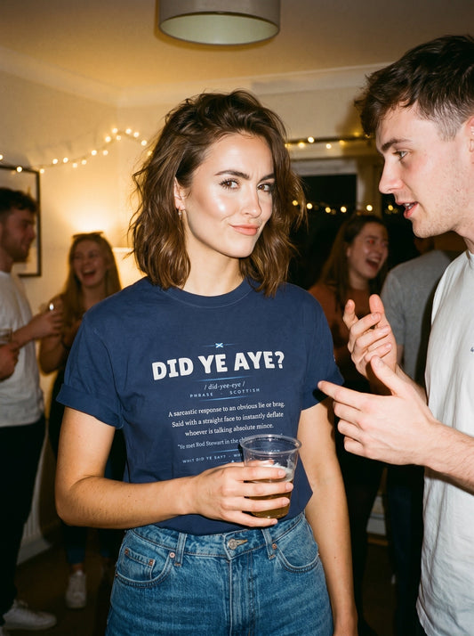 Woman at a party wearing the navy DID YE AYE dictionary definition tee