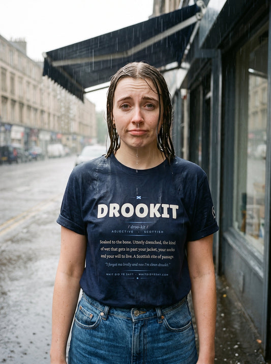 Woman soaked in the rain wearing the navy DROOKIT dictionary definition tee